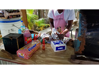 Jerk chicken cooked outdoors in Ochi.